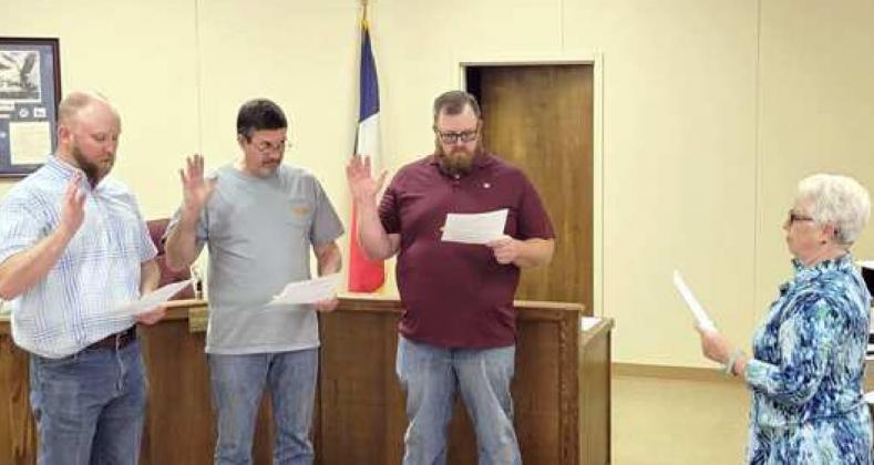 LITTLEFIELD OFFICIALS SWORN IN – City Secretary Janine Butler, right, is shown as she administered the oaths of office for the three city council members who were declared as elected earlier, since they had no opponents on the ballot. Repeating their oaths, left to right, are Mayor Eric Turpen; Kenny Rucker, District 4; and Buddy Holmes, Disrict 3. (Submitted Photo)