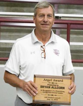 Littlefield senior, Kennadi Hanlin, presented the Student Council Angel Award to Bryan AllCorn at the Littlefield High School Awards Ceremony last Tuesday. (Staff Photo by Derek Lopez)