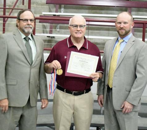 Gary Birkelbach and Eric Turpen were on hand at the Littlefield High School Award Ceremony last Tuesday morning to present Superintendent, Mike Read, with the Lamar Achievement Award. (Staff Photo by Derek Lopez)