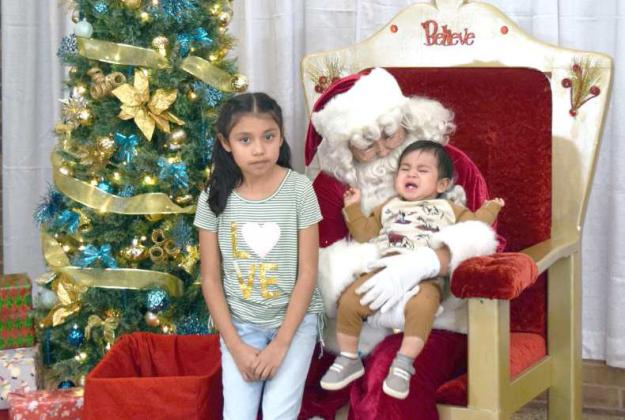 This youngster is not at all impressed by Santa Clause when they first meet at the Lamb Healthcare Center Photos with Santa event held on Tuesday, December 6, 2022. (Photo by Ann Reagan)