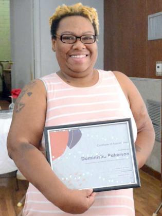 Dominisha Patterson received a Certificate of Appreciation for outstanding volunteering. Patterson is posing with her certificate after receiving it at the Littlefield and Dunbar Reunion on Saturday, Sept. 3, 2022.