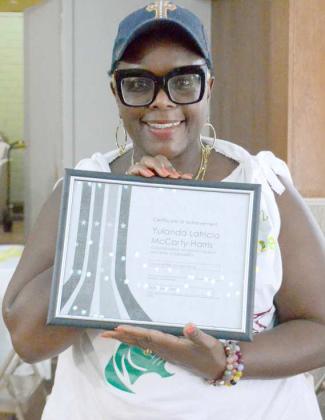 Yulanda “LaTrecia” McCarty-Harris received a Certificate of Achievement for getting her Doctorate of Education from the University of Texas at Austin.