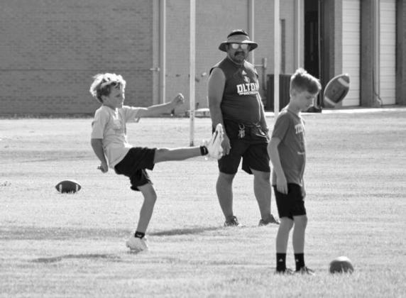 Olton football campers work on punting, during the annual Mustang Youth Football Camp that took place July 27-29. (Photo by Leon Szaniszlo)