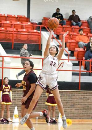 Littlefield senior guard, Jasmine Castillo (32), goes up strong for a lay-up, during the first half of the Lady Cats, 65-21, Bi-district playoff victory over the Kermit Lady Jackets on Monday at Seagraves. (Staff Photo by Derek Lopez)