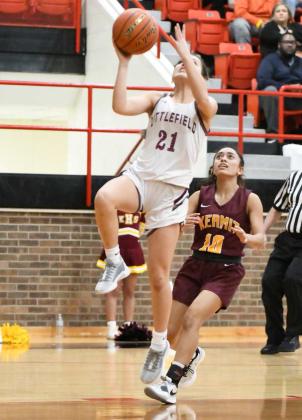 Littlefield junior, Cali Saldana (21), drives in for a lay-up, during the first half of the Lady Cats, 65-21, Bi-district play-off victory over the Kermit Lady Jackets on Monday at Seagraves. (Staff Photo by Derek Lopez)