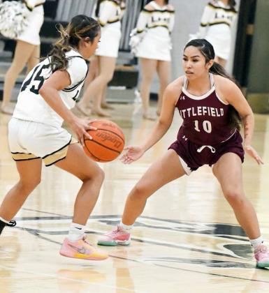 Littlefield’s Nevaeh Esquibel (10), guards the ball at midcourt, during the second half of the Lady Cats’, 48-44, road victory over the Lady Westerners Tuesday night. (Staff Photo by Derek Lopez)