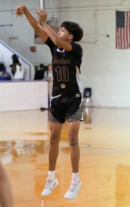 Sudan’s Christian Delgado fires up a three from the left elbow, during the second half of the Hornet’s road victory over the Bulldogs in Amherst on Tuesday. (Staff Photo by Derek Lopez)