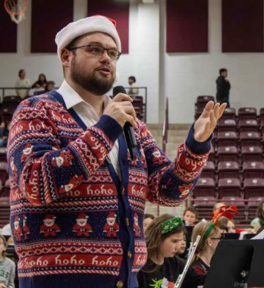 The new director of bands at Littlefield High School, John Barry, speaks at their annual Christmas band concert on Dec. 10, 2025. (Photo by Madison Vidales)