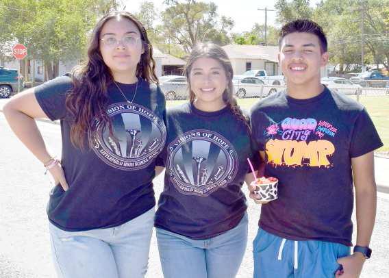 Left to right- Lindsey Fuentes, Chloe Diaz, and Even Cristan visit the very popular Neon Spoon for a cool frozen yogurt at the Wildcat Band Block Party on Saturday, August 19, 2023