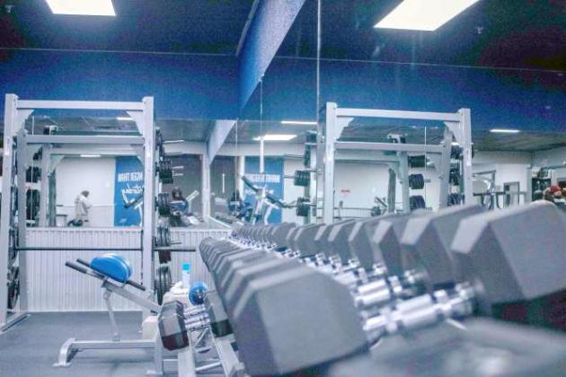Dumbells and other weight-lifting machines are available to customers at Energy Fitness, located in Littlefield. (Staff Photo by Madison Vidales)