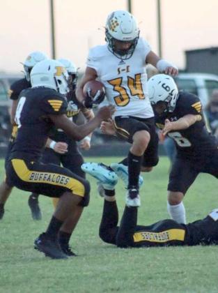 Springlake-Earth junior, Joshua Tovar, looks to make something happen during a kick-off return before he is brought down by the Buffaloes, during the second quarter of the Wolverine’s, 40-35, loss to Petersburg on Friday at Buffalo Stadium. (Photo by Hannah Alvarez)