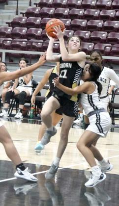 Sudan’s Addison Cornelius, goes up strong to the basket and draws a shooting foul, during the second quarter of the Nettes’ tournamentopener against Muleshoe on Thursday in Abernathy. (Staff Photo by Derek Lopez)