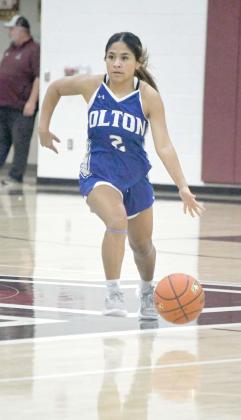 Olton’s Evelyn Matute brings the ball down court for the Fillies looking to spark the offense, during the second half of their tournamentopener against Wellington on Thursday in Abernathy. (Staff Photo by Derek Lopez)