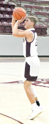 LOOKING FOR THREE —Littlefield junior guard, Ethan Garcia (22), fires a three from the left elbow for the Wildcats, during the first half of their home game against the Andrews Mustangs on Monday. The Wildcats won the contest, 61-35, at Wildcat Gym. (Staff Photo by Derek Lopez)