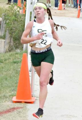 4X REGIONAL CHAMPION - Springlake-Earth senior, Taytum Goodman, crosses the bridge for the last time at Mae Simmons en route to her fourth consecutive 1A Regional cross country championship. She clocked a time of 11:31.5, helping the Lady Wolverines’ to their second consecutive Regional Championship. (Staff Photo by Derek