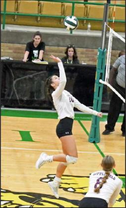 Littlefield’s Julie Bownds looks to dump a ball over the Idalou blockers, during their match on the road on Tuesday in Idalou. The Lady Cats fell just short in the district match-up, dropping the match, 2-3. (Staff Photo by Derek Lopez)