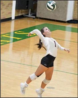 Littlefield’s Bryndle Ray delivers a serve, during their match on the road on Tuesday in Idalou. The Lady Cats fell just short in the district match-up, dropping the match, 2-3. (Staff Photo by Derek Lopez)