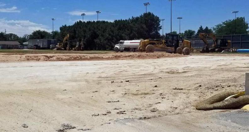 Parkhill and Teinert are making progress at the site of the new Littlefield High School. On Thursday they were levelling and packing some dirt. (Staff Photo by Derek Lopez)