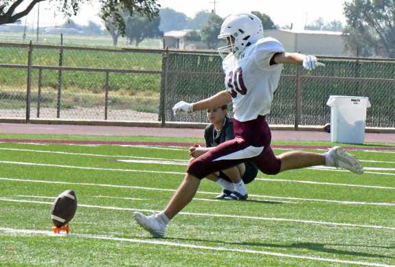 Littlefield kicker, Adam MacDonald gets set to boot the kick-off down field, during the Wildcats’ intersquad scrimmage on Saturday at Wildcat Stadium. (Staff Photo by Derek Lopez)