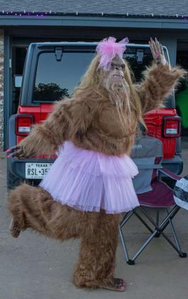Big Foot makes an appearance on Halloween by handing out candy to trick-or-treaters on Oct. 31. (Staff Photo by Madison Vidales)