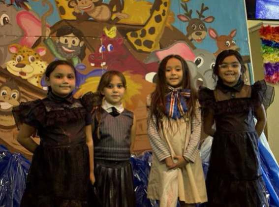 Three Wednesday Adams and Megan pose for picture at the Hillcrest Funeral Home Trunk or Treat on Oct. 31. (Staff Photo by Rhode Duenas)