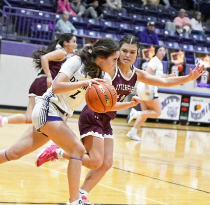 Littlefield’s Cali Saldana (12) applies full-court ball pressure against Dimmitt, during the first half of their district contest on Friday. (Staff Photo by Derek Lopez)