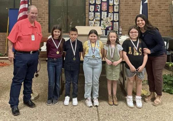 ROTARYTHIRD GRADE MOST IMPROVED READERS - Izabella Moore, Mackenzie Lopez, Mia Lucero, Gabriel Sierra and Brylee Salazar, shown with Judge Mike DeLoach and Rotary President-Elect Lori Zinn. (Submitted Photo)