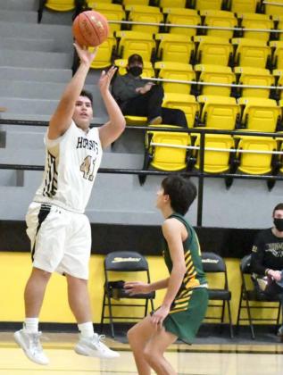 SHOOTING THE JUMPER— Sudan junior, Abram Rodriguez (41), fires up a jumper from the right wing over Springlake-Earth’s Evan DeLeon (1), during the second half of the Hornets’ home loss to the Wolverines on Saturday. (Staff Photo by Derek Lopez)