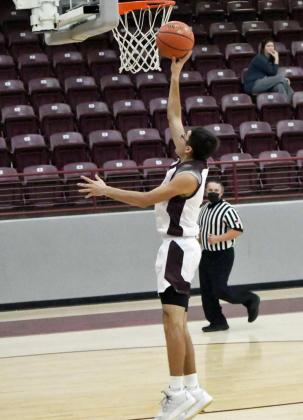 FINISHING THE BREAK — Littlefield junior, Jaron Cabello, catches an outlet pass from senior guard, Juan Rios, and drops it in for a layup to finish off the fast-break, during the first half of the Wildcats’ victory over Sundown on Tuesday at Wildcat Gym. (Staff Photo by Derek Lopez)