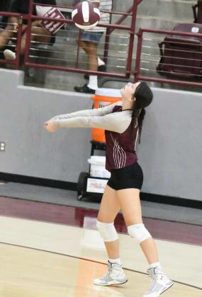 KEEPING THE BALL IN PLAY - Littlefield’s Lady Cat, Madi Brown, bumps a ball up into the air, as the Lady Cats look to go on the attack, during their, 0-3 loss to Ropes at Wildcat Gym on Tuesday. (Staff Photo by Derek Lopez)