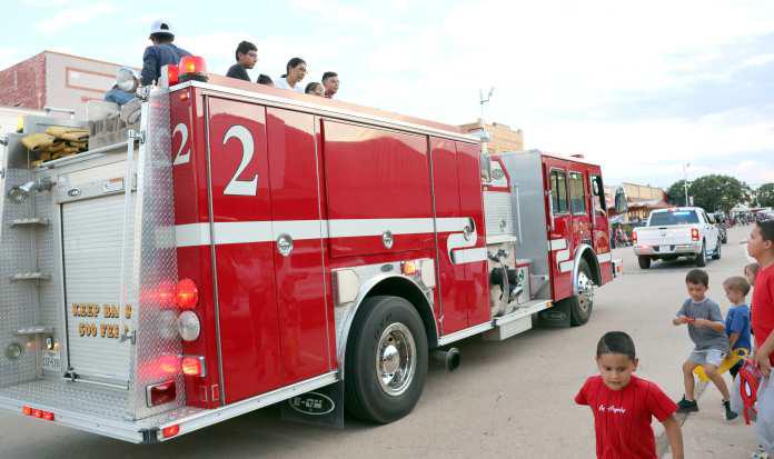 The Littlefield Fire Dept. started off the tossing of candy for the kids at the Homecoming Parade downtown Littlefield. (Photo by Ann Reagan)