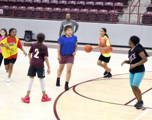 BASIC BASKETBALL SKILLS taught during the Littlefield Lady Cat Summer Basketball Camp. (Photo by Derek Lopez)