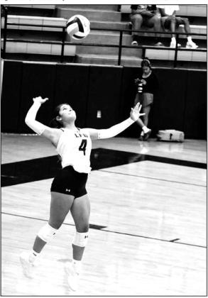 Littlefield’s Abby Rodriguez, leaps up to deliver a serve, during the Lady Cats’ five-set thriller with Post last Tuesday on the road. (Staff Photo by Derek Lopez)