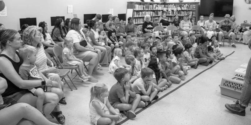 Attendees of the weekly Olton Area Library summer event receive a presentation from Calvin Rueda and Liz Bezner from Wild West Wildlife on June 17, 2026. (Photo by Madison Vidales)
