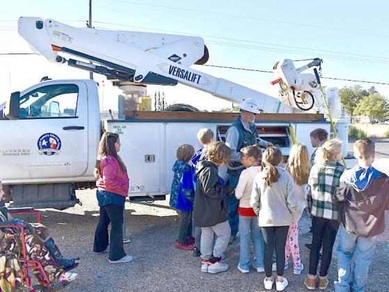 Lamb County Electric Cooperative- Jeremy Newton. Demonstrated electric power safety and tools of the trade. Kids were able to observe and hold safety items. (Submitted Photo)