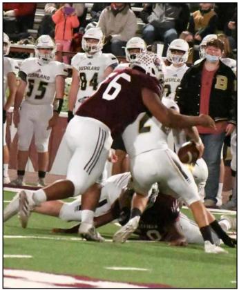 SACKING THE QUARTERBACK – Littlefield junior nose tackle, Kevie Hood, sacks Bushland quarterback Coleman Junell for a huge loss on fourth down for a turnover on downs in the second quarter of Friday’s tough loss to the Falcons at Wildcat Stadium. (Staff Photo by Derek Lopez)