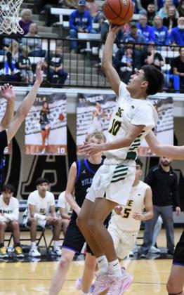 GOING UP STRONG - Springlake-Earth junior, JJ Jaramillo, drives to the basket and puts up a floater in the lane, during the second half of the Wolverines’ 1A Bi-district loss to the Wildorado Mustangs on Tuesday at Canyon Randall. (Staff Photo by Derek Lopez)