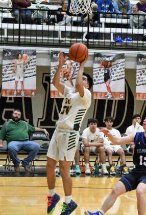 GETTING TO THE BASKET - Springlake-Earth’s, FroylandAgundiz, gets to the baket for a lay-up, during the second half of the Wolverines’ 1A Bi-district loss to the Wildorado Mustangs on Tuesday at Canyon Randall. (Staff Photo by Derek Lopez)