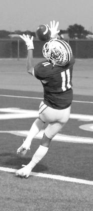 Littlefield’s Zane Champion catches a 27-yard touchdown pass from Sammy Saenz, during the second quarter, of the Wildcats’ Homecoming victory over Coahoma on Friday at Wildcat Stadium. (Staff Photo by Derek Lopez)