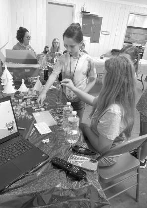 Campers at the 4-H Project Camp are shown making calming jars and learning ways to deal with stressful situations, during day one of Project Camp on Monday at the Lamb County Ag Center. (Submitted Photo)