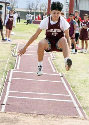 Littlefield seventh grader, Nehemiah Beanes, completes a jump during the seventh grade boy’s long jump competition last Thursday at the Wildcat Relays in Littlefield. (Staff Photo by Derek Lopez)