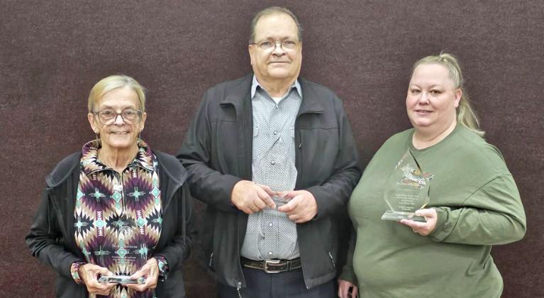 Seven County Employees were honored with plaques for their years of service at the Lamb County Thanksgiving Luncheon that was held at the MAC at First Baptist Church. (Shown) Bridgette Harmon, who accepted the plaque on behalf of her late husband Scott Harmon, Jay Livingston and Barbara Klatt. (Not Pictured): Dusty Harmon, Carrie Barden, Laura Alcarez and Jaime Leal. (Staff Photo by Derek Lopez)