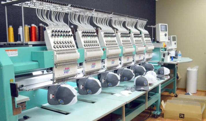 This machine is used to create designs on hats at Sandy Sky Design in Littlefield. (Staff Photo by Samantha Pontius)