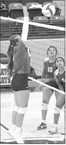 Littlefield’s Maggie McNeese delivers a block, during the third set of the Lady Cats Littlefield Tournament-opening loss to the Fillies last Thursday. (Staff Photo by Derek Lopez)