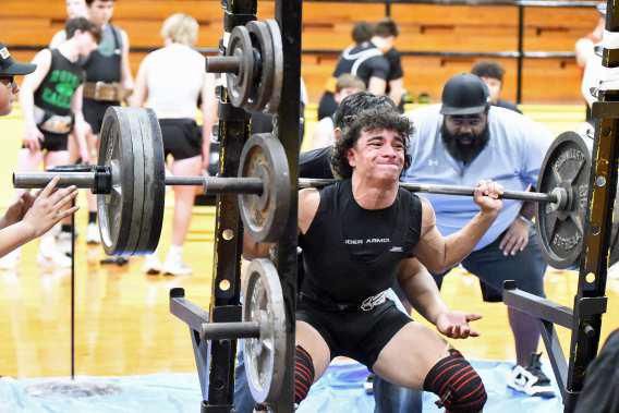 Sudan’s Matthew Lopez is shown squatting 405 lbs at their Powerlifting Meet in Sudan against New Home and Ropes. (Staff Photo by Derek Lopez)