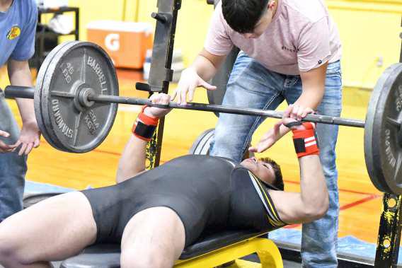 Sudan’s Jaden Conley throws up 225lbs on bench press at their Powerlifting Meet in Sudan against New Home and Ropes. (Staff Photo by Derek Lopez)