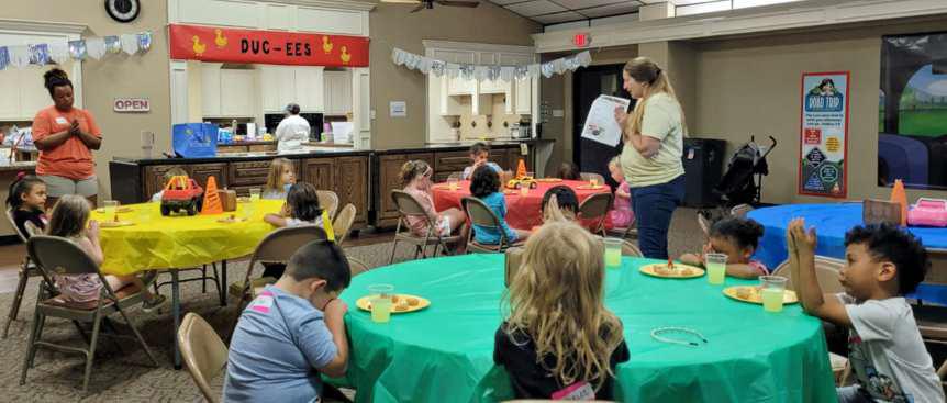 Chrissy Bass leads a prayer for the pre-k and kindergarten kids, during snack time at Vacation Bible School on Monday at the Littlefield Methodist Church. (Submitted Photo)