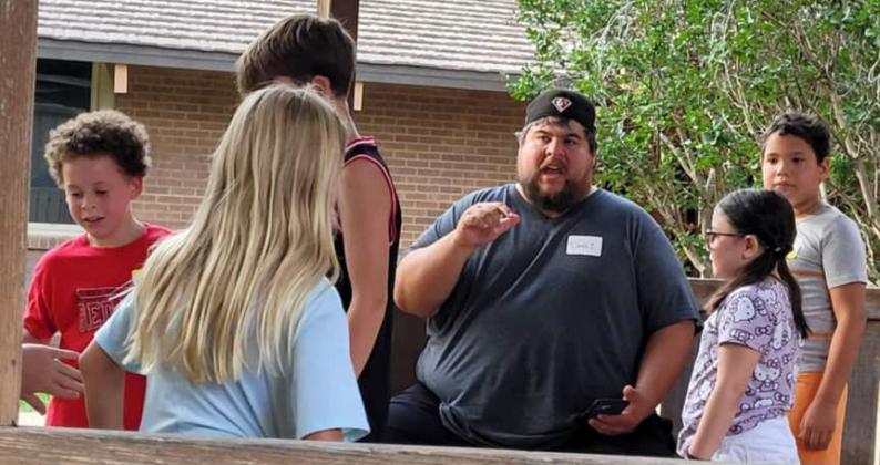 Derek Lopez explains what the kids are going to do during his section of the first night of Vacation Bible School at the Littlefield Methodist Church on Monday. Kids participated in various activies, while learning about Jesus. (Submitted Photo)
