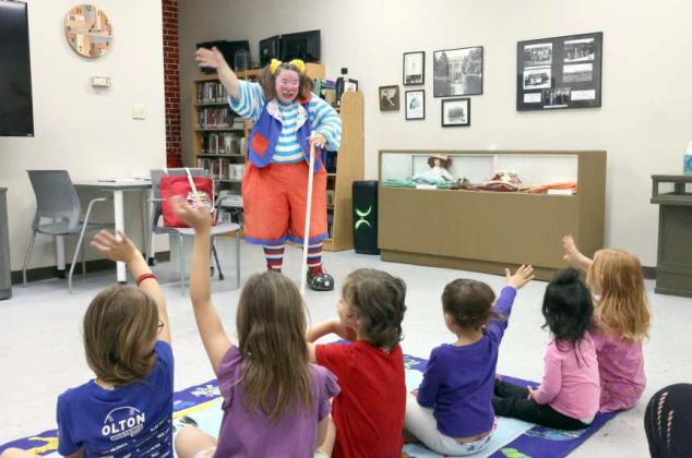 These are the kids that came to the Skeeter the Clown show at the library. (left to right) Abigail Stevenson, Brinn Redwine, Bailey Redwine, Baron Redwine, Skeeter the Clown, Khali Sanchez, and Sienna Hernandez. (Photo Courtesy of Olton Chamber of Commerce)