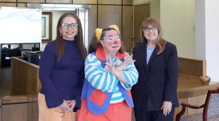 (left to right) Jennifer Cerbantez, Skeeter the Clown, and Kyla Howell, from Wellington State Bank, another one of our ticket outlets for the circus. (Photo Courtesy of Olton Chamber of Commerce)